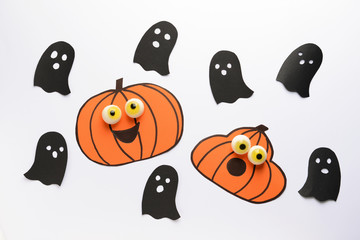 Composition with Halloween decor on white background
