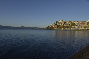 Fototapeta premium The old village on the promontory lake