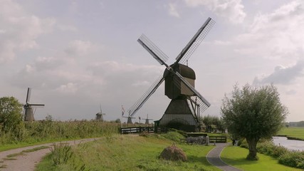 Old windmill spinning in the wind