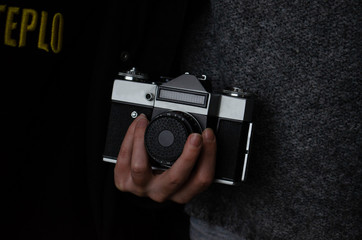 hand with old soviet analog camera