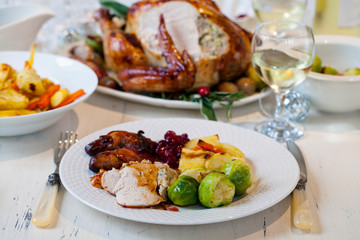 Christmas dinner with stuffed turkey and roast vegetables