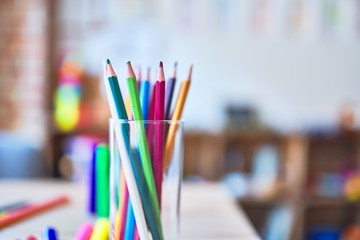 Desk with lots of colored pencils and pen to draw at kindergarten