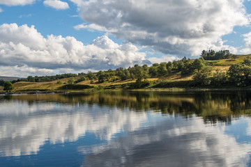 Fototapeta na wymiar Clouds Reflected in the River of Awe at Cruachan Dam, Scotland