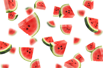 Falling watermelon isolated on white background, selective focus - obrazy, fototapety, plakaty