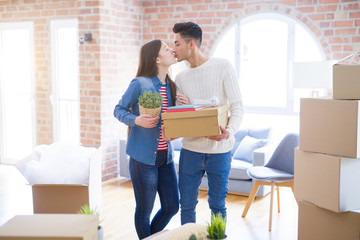 Beautiful young asian couple looking happy and smiling excited moving to a new home