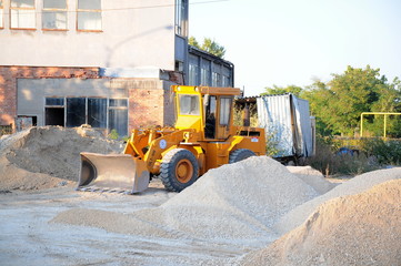Excavator stands parked on construction site