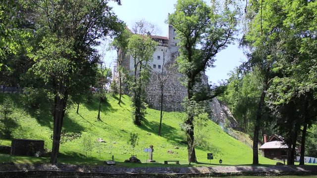 BRAN CASTLE, TRANSYLVANIA, ROMANIA - June 26, 2017: Outside view of the castle that gave rise to the legend of Dracula from the pen of Bram Stoker. HD video