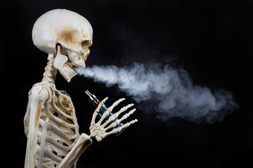 Skeleton vaping clouds of vapor with an ecigarette