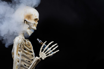 Skeleton vaping clouds of vapor with an ecigarette