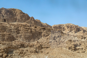 Fototapeta na wymiar Caves in the Hills at Qumran National Park, Dead Sea Scrolls, Israel