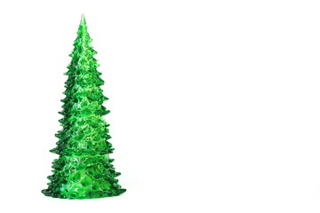 Green toy Christmas tree isolated on white background. Copy space.