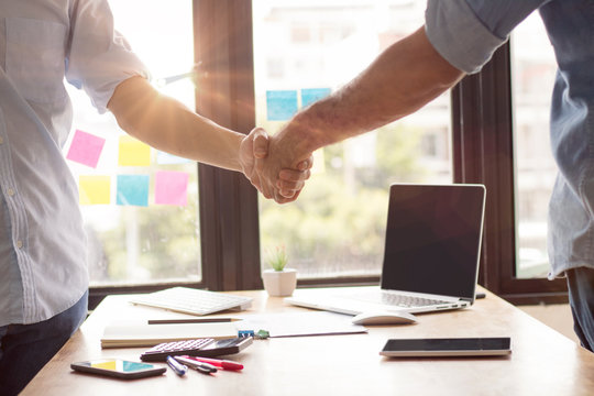 successful negotiate and handshake concept, two businessman shake hand with parthner to celebration partnership and teamwork, business deal