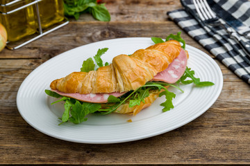 croissant with mortadella and greens