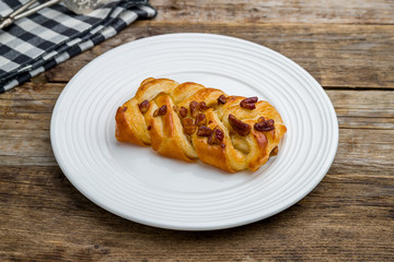 puff with maple syrup on wooden table