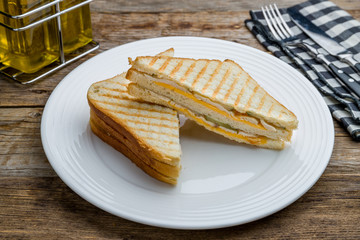 ham and cheese sandwich on wooden table