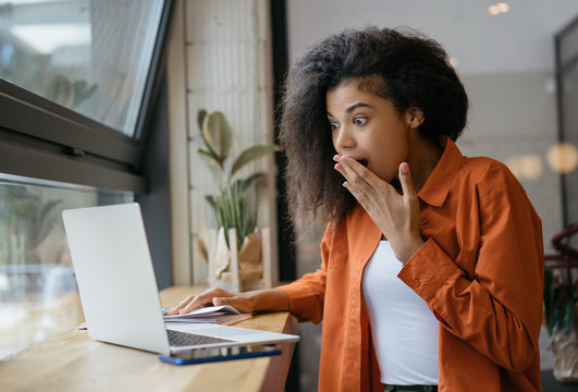 Premium Photo  Lucky day emotional black woman looking at laptop