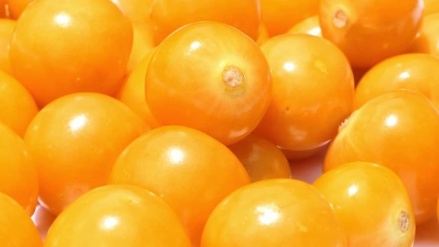 Groundcherry fruits with water drops rotated. Close up Ripe fresh Physalis plant, yellow berry. Cape gooseberry. Goldenberry. Slow motion 4K UHD video. fresh gooseberries in water