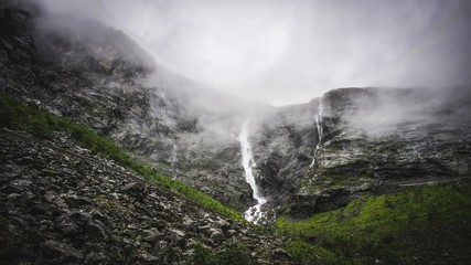 misty waterfall in the mountains