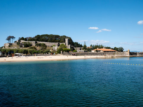 bayona beach, castle and wall
