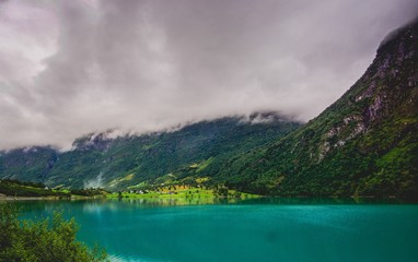 misty turquoise lake in the fjord