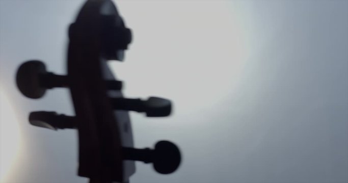 Rotating cello musical instrument head rotating