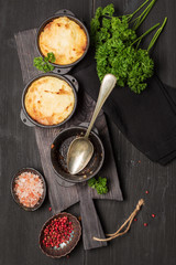 Shepherd's pie, british casserole in cast iron pan, with minced meat, mashed potatoes and...