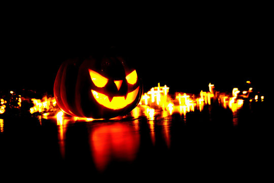 Halloween background orror magic face soft focus on dark background with bokeh of cross