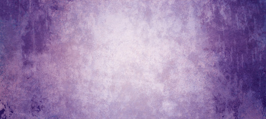 Textured purple background with grungy dark borders and lots of distressed old vintage grunge texture in elegant violet and royal purple colors © Attitude1