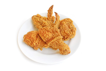 A plate of fresh crispy fried chicken on a white background