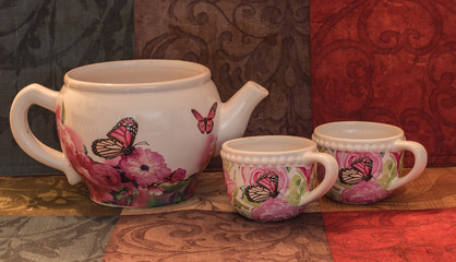 tea pot family with colorful tea cups