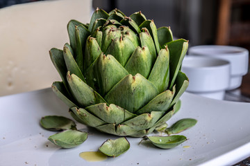 artichoke with oil served on a plate