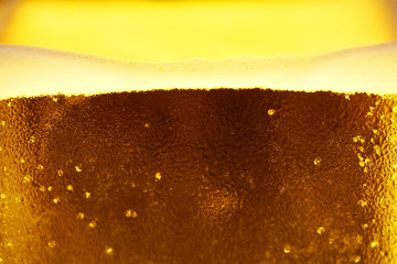 close up of cold larger beer in glass