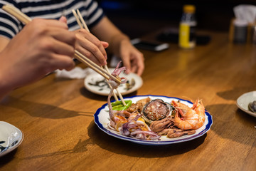 eat plate of seafood on table