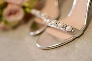 Heels for the bride and beautiful bouquet of flowers