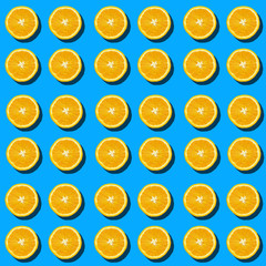 Colorful orange slices pattern with shadows on blue background.