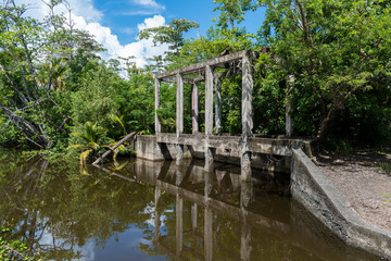 Fototapeta na wymiar Ruins by the river in a natural reserve