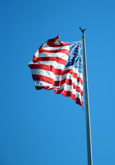 waving USA flag on pole isolated on white