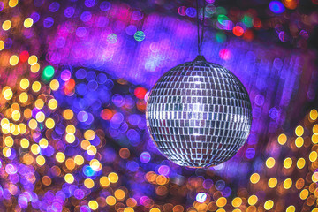 Festive abstract image with defocused lights. Disco party. Copy space.