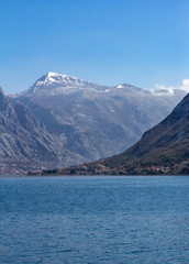 View of a village and cliffs surrounding the Bay of Kotor in Montenegro