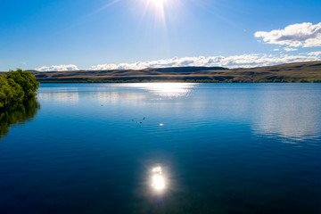 Sunny rays over lake Tekapo, New Zealand