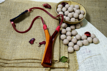 Catapult shaft and ammunition made from clay. Put on sackcloth