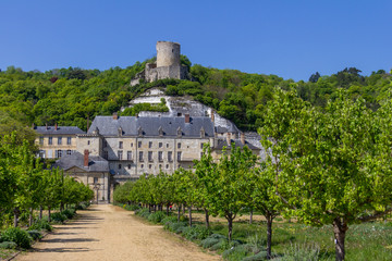 Fototapeta na wymiar The tower of Chateau de La Roche-Guyon is perched atop the hill above the new chateau and garden