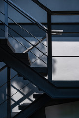 Stairway with black metallic banister modern building architecture decoration
