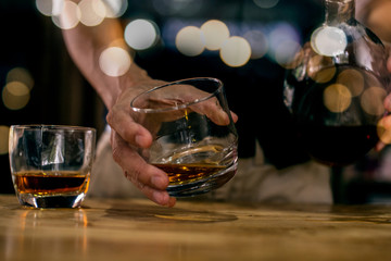 bartender pouring beer in glass