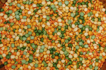 Pea and lentil. Green and orange food background