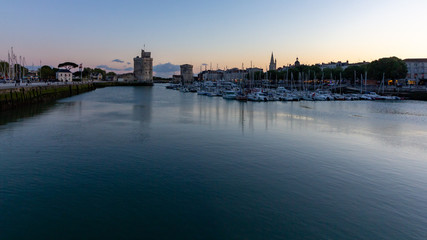 The towers at the entrance of La Rochelle harbor at sunset