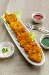 Heart shape cutlets with sauce and green chutney