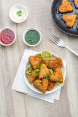 Heart shape cutlets with sauce and green chutney