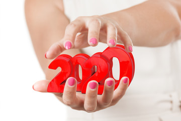 Two Woman Hands Protecting 2020 New Year Sign.