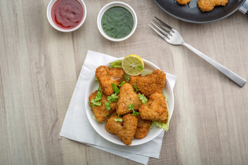 Heart shape cutlets with sauce and green chutney